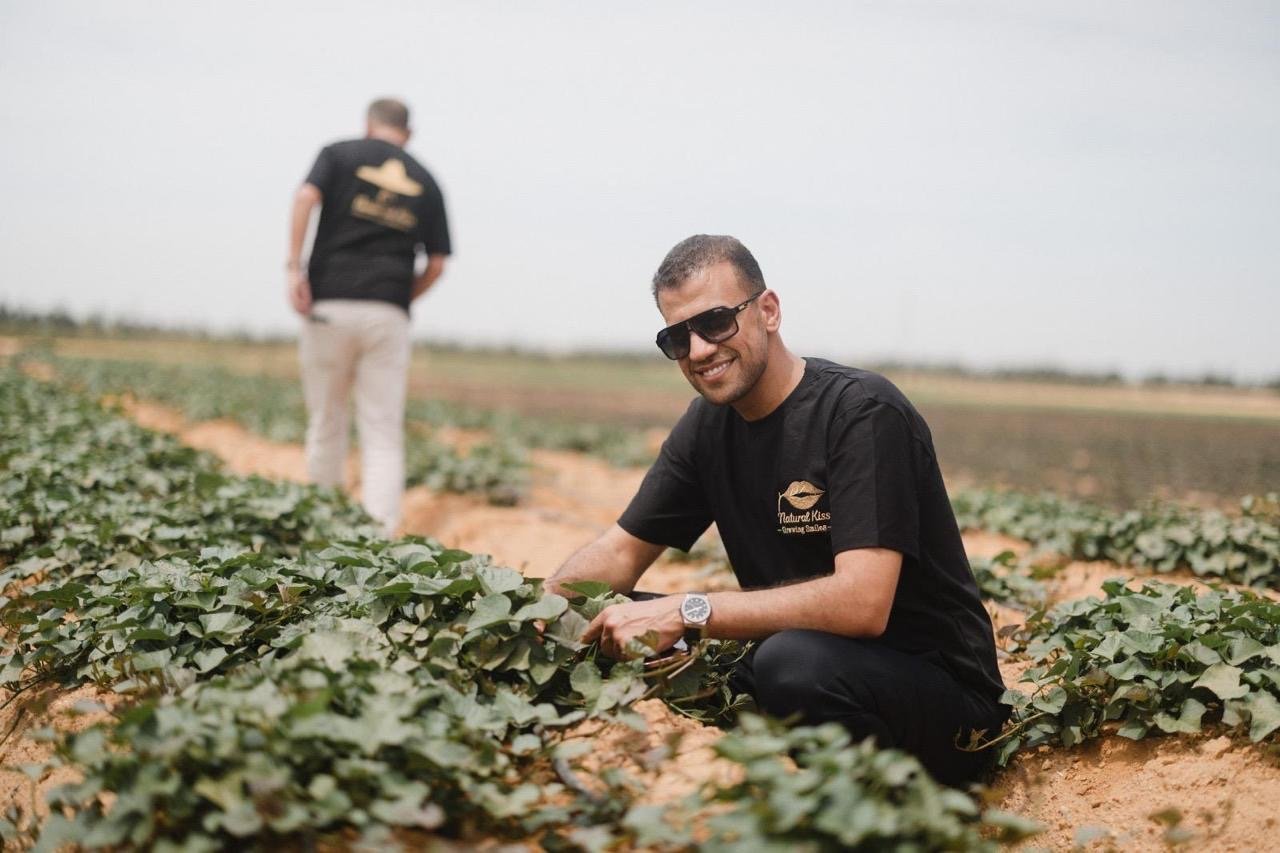Founder in the field — hands in the soil