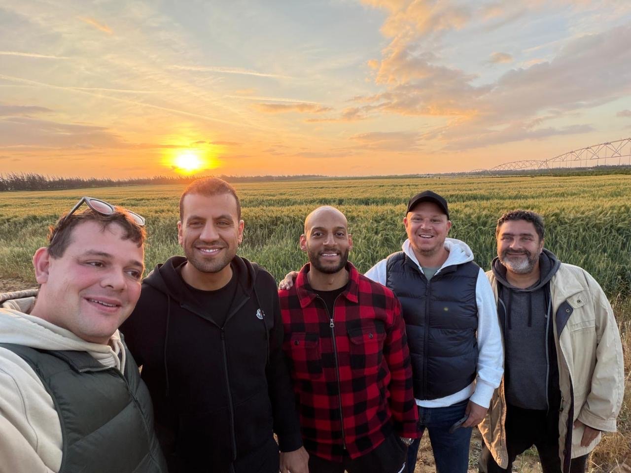 Team together at sunset